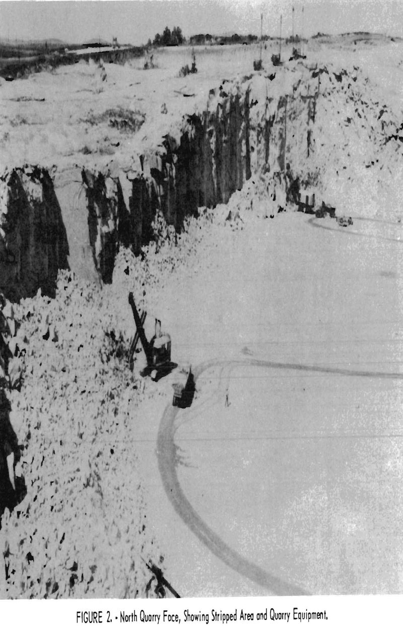 crushed-granite north quarry face showing stripped area and quarry equipment